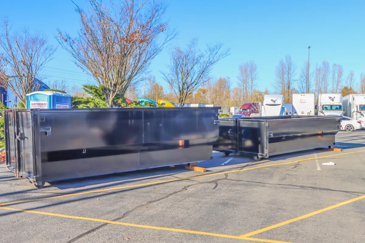 Professional dumpster rental service with roll-off container on residential driveway in Flossmoor